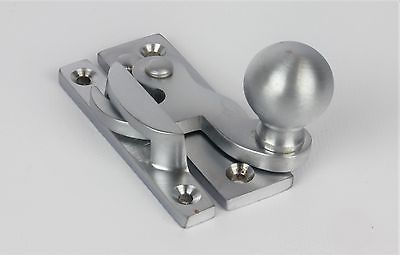 A satin chrome claw sash fastener with a ball knob