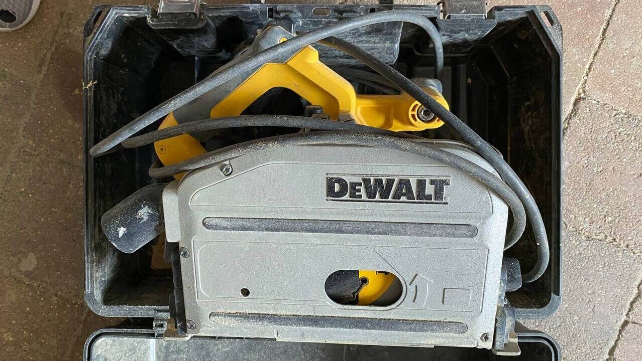 A DeWalt handheld circular saw in its case