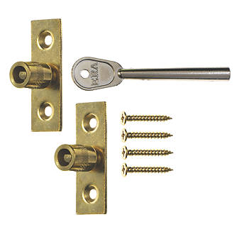 Two brass sash stops with their key and screws