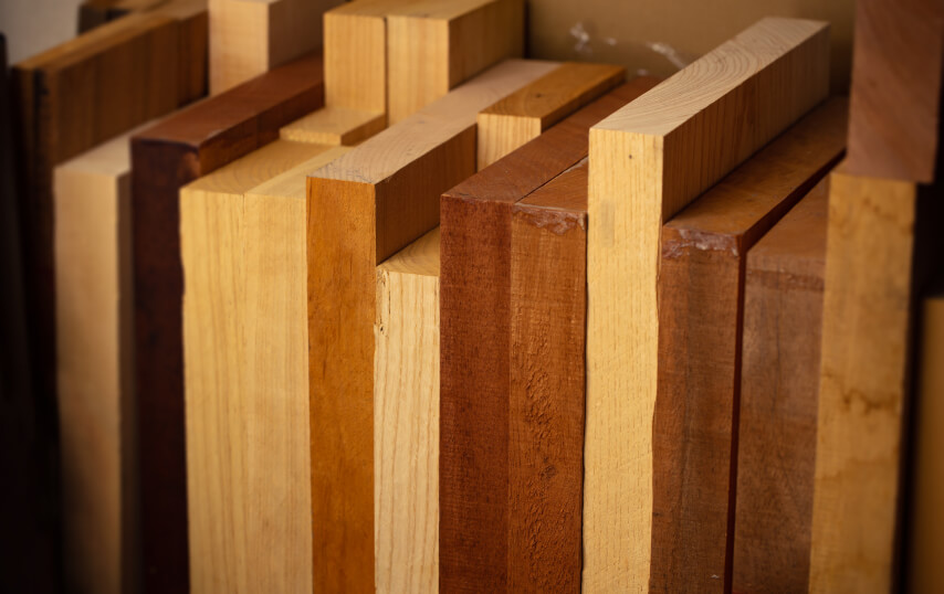 Boards of mahogany and other hardwoods stacked on end