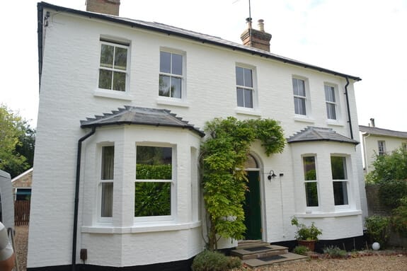 Repairs to sash windows and painting of masonry walls