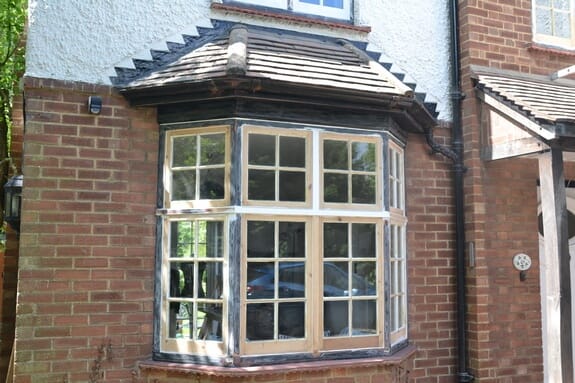 Renovation of wooden windows and painting of masonry walls