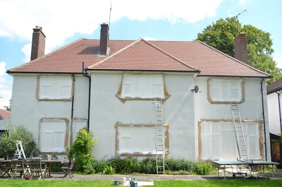 property windows sprayed over masking paper 