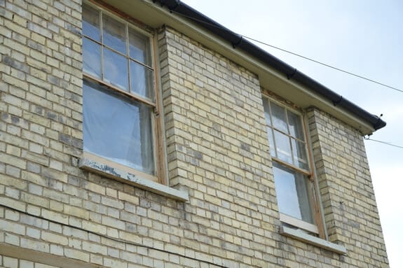 bare wood sash window frame after sanding 