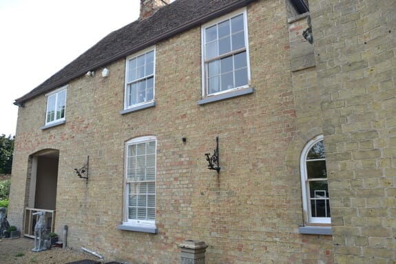 brick building and wooden frame windows