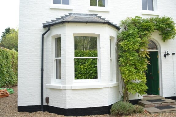 Repairs to sash windows and painting of masonry walls