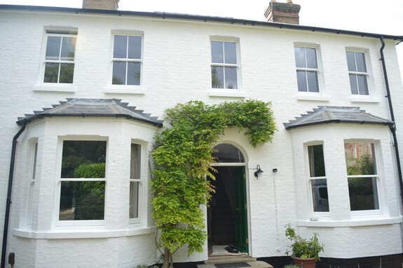 Repairs to sash windows and painting of masonry walls