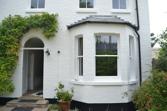 Repairs to sash windows and painting of masonry walls