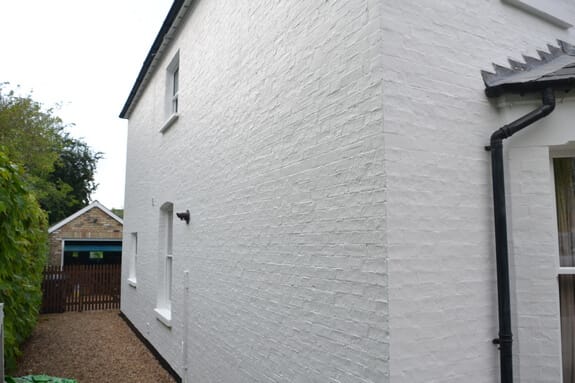 Repairs to sash windows and painting of masonry walls