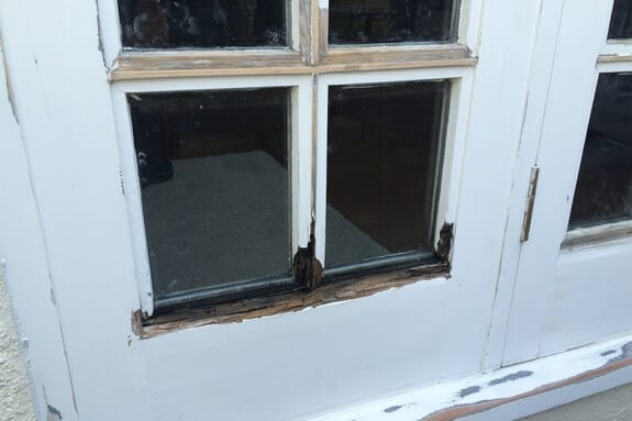 Decayed wooden beadings on French door