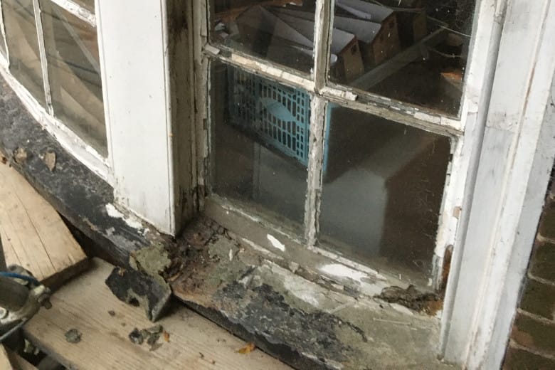 Before: A curved sash window sill rebuilt