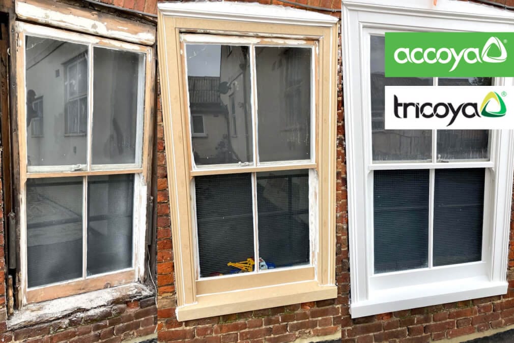 Three double glazed sash windows showcasing repainted frames.
