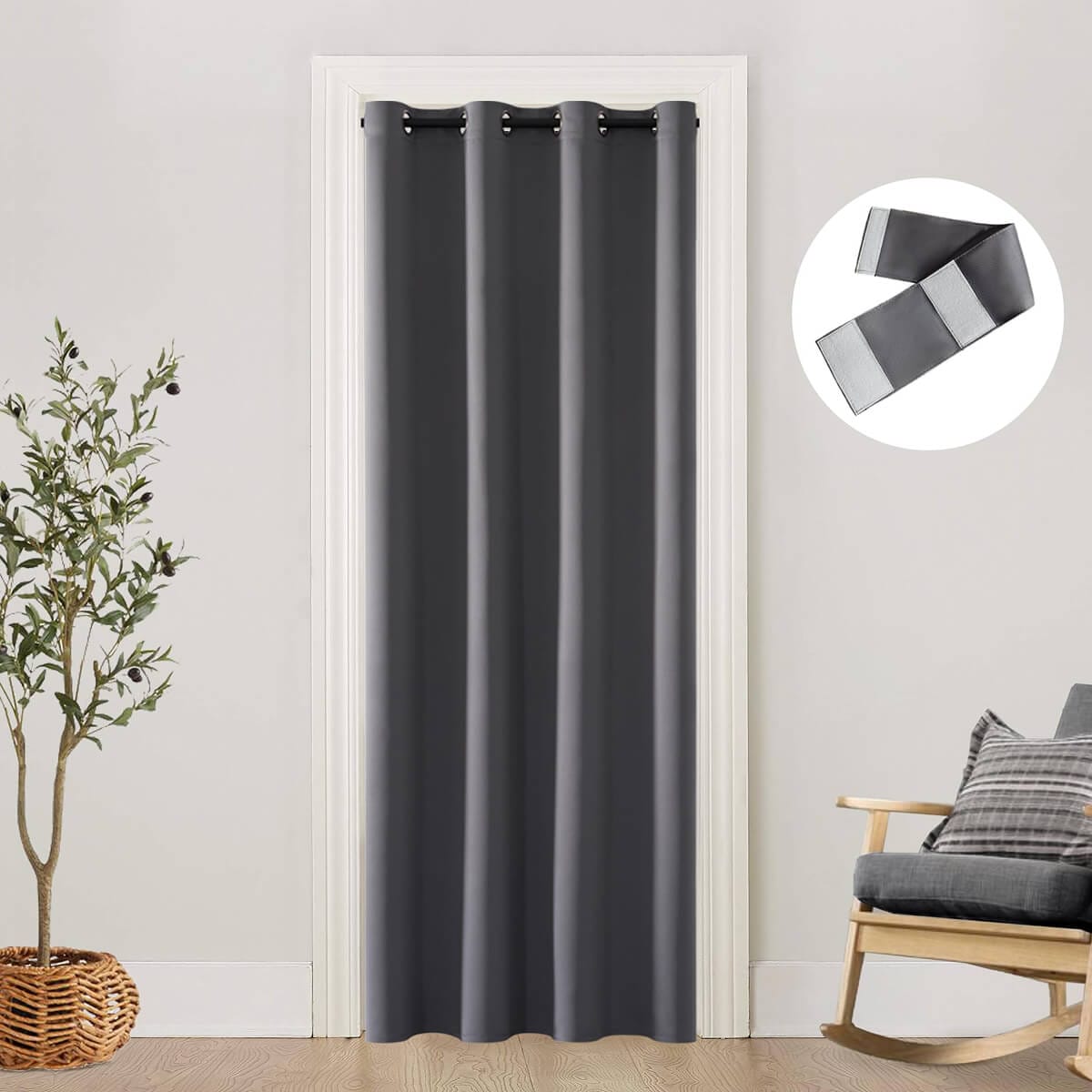 Dark grey thermal eyelet curtain hung across an internal doorway